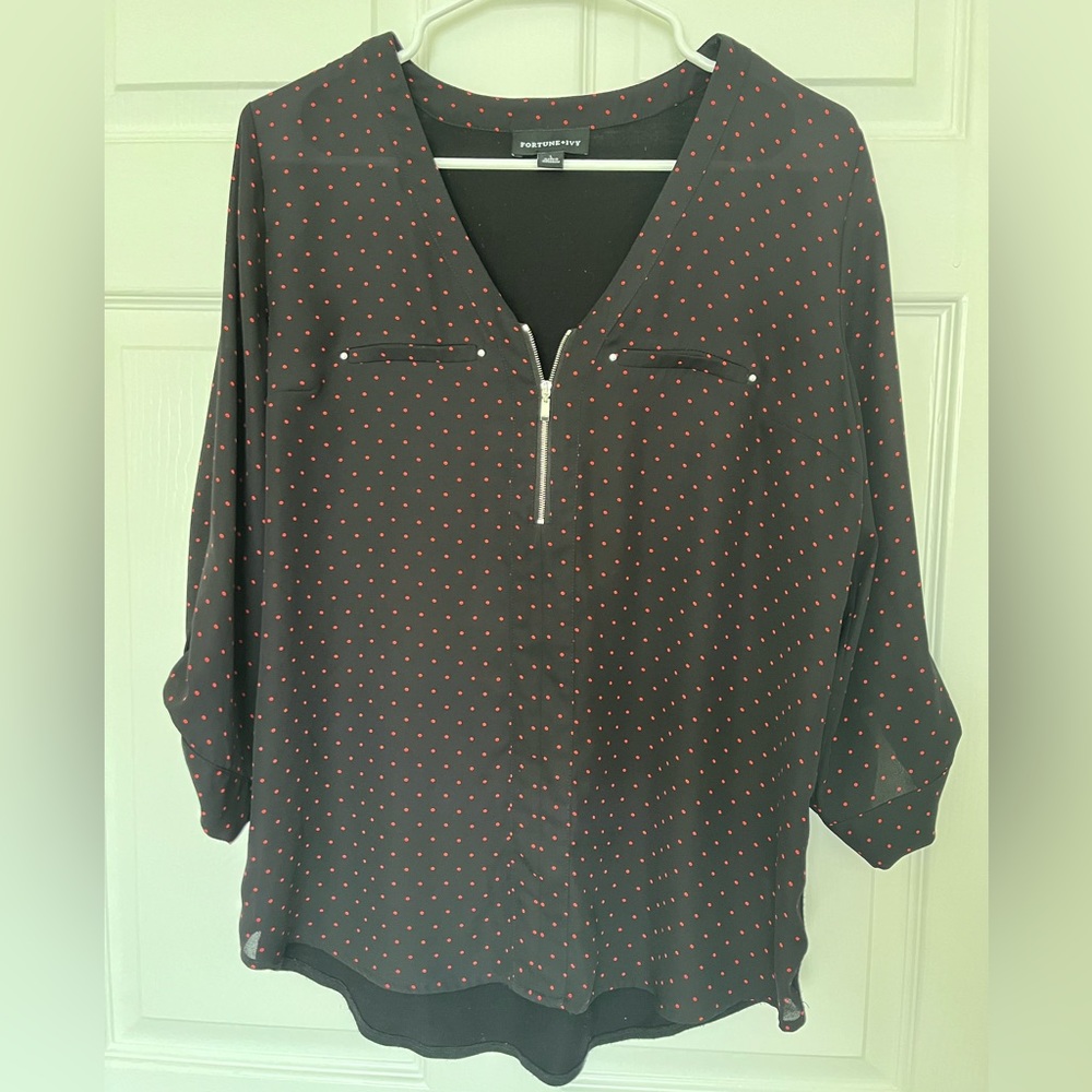 Cute blouse great condition. The back is a cotton blend material